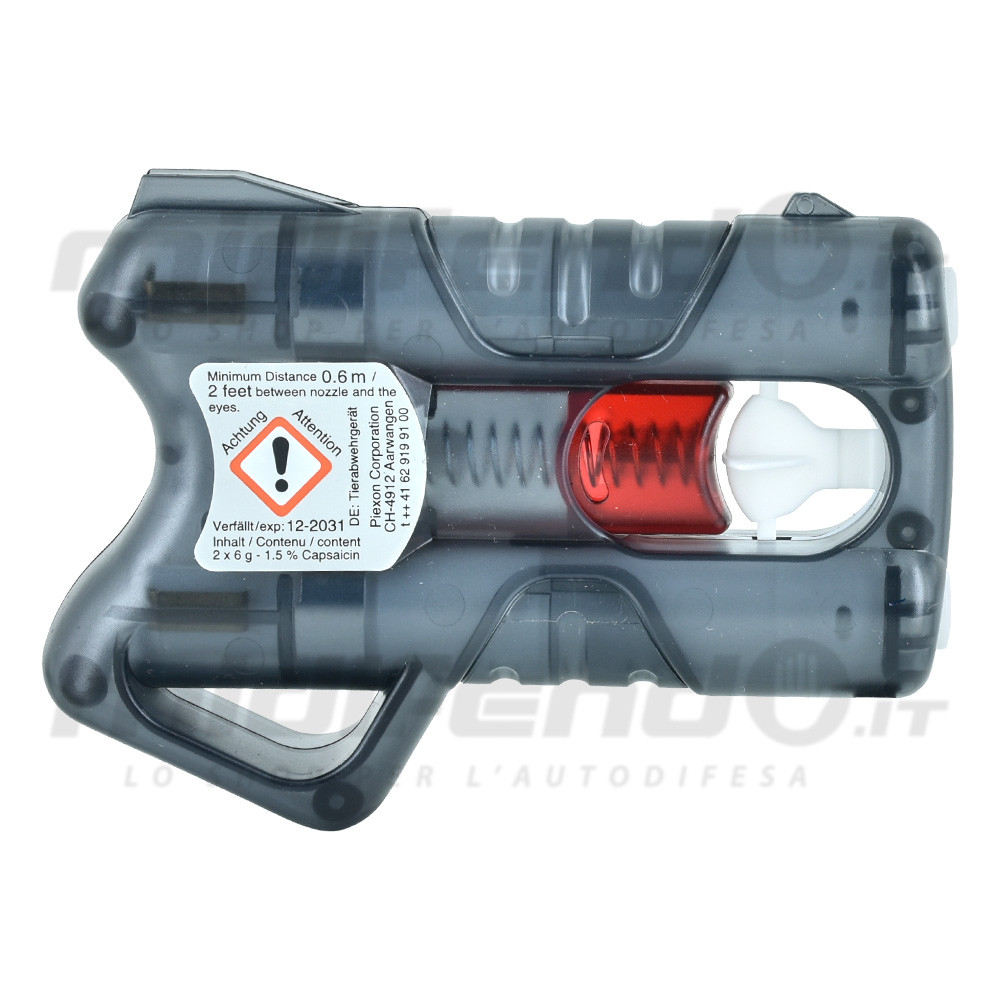 Vista laterale pistola spray al peperoncino Piexon con scocca grigia semitrasparente, cartucce rosse visibili e etichetta di sicurezza 1.5% capsaicina scadenza 2031